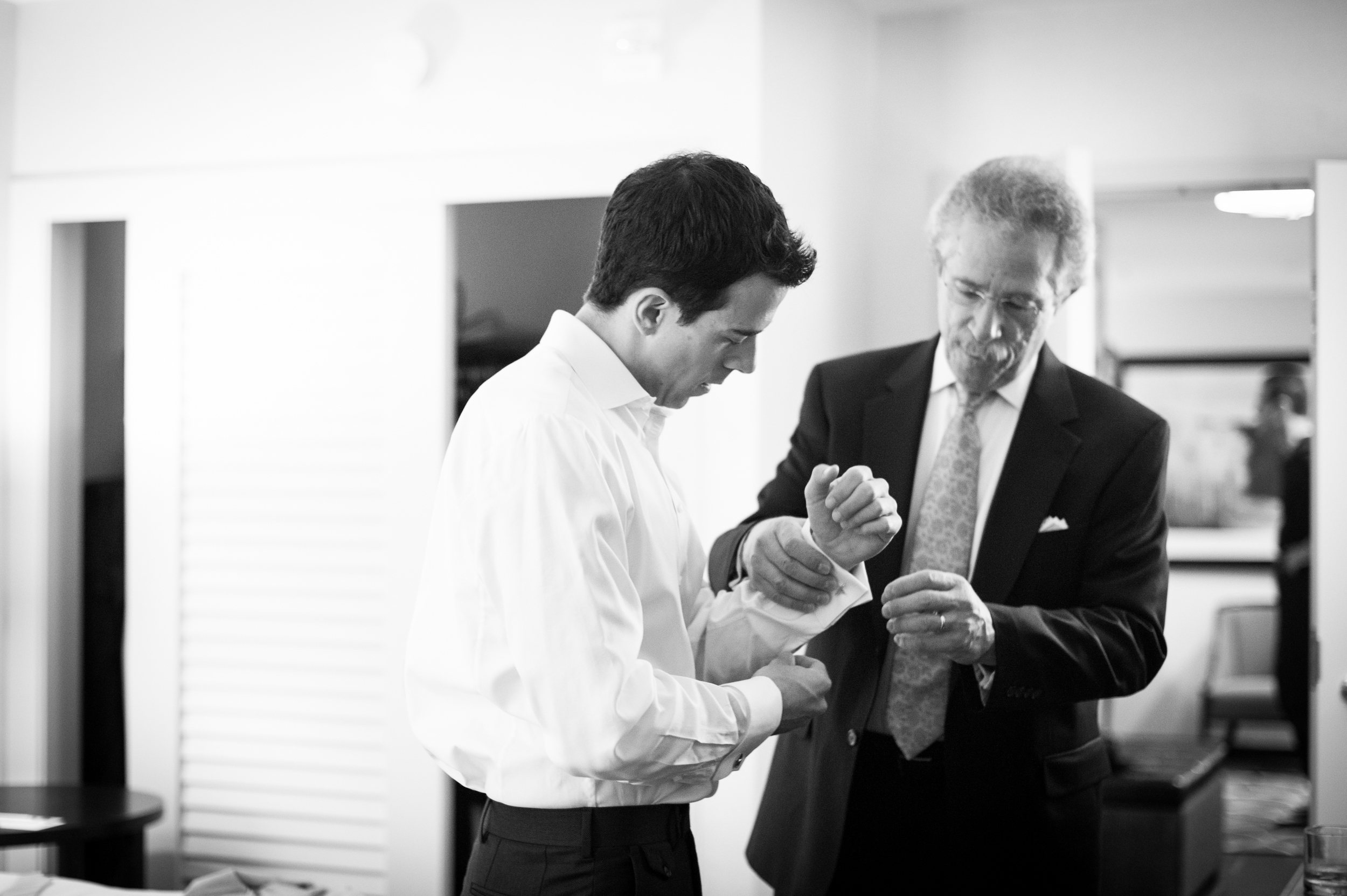 Image:&nbsp;  Premack Weddings  My dad helps my husband put on cufflinks that belonged to my Great-Grandfather on our wedding day.